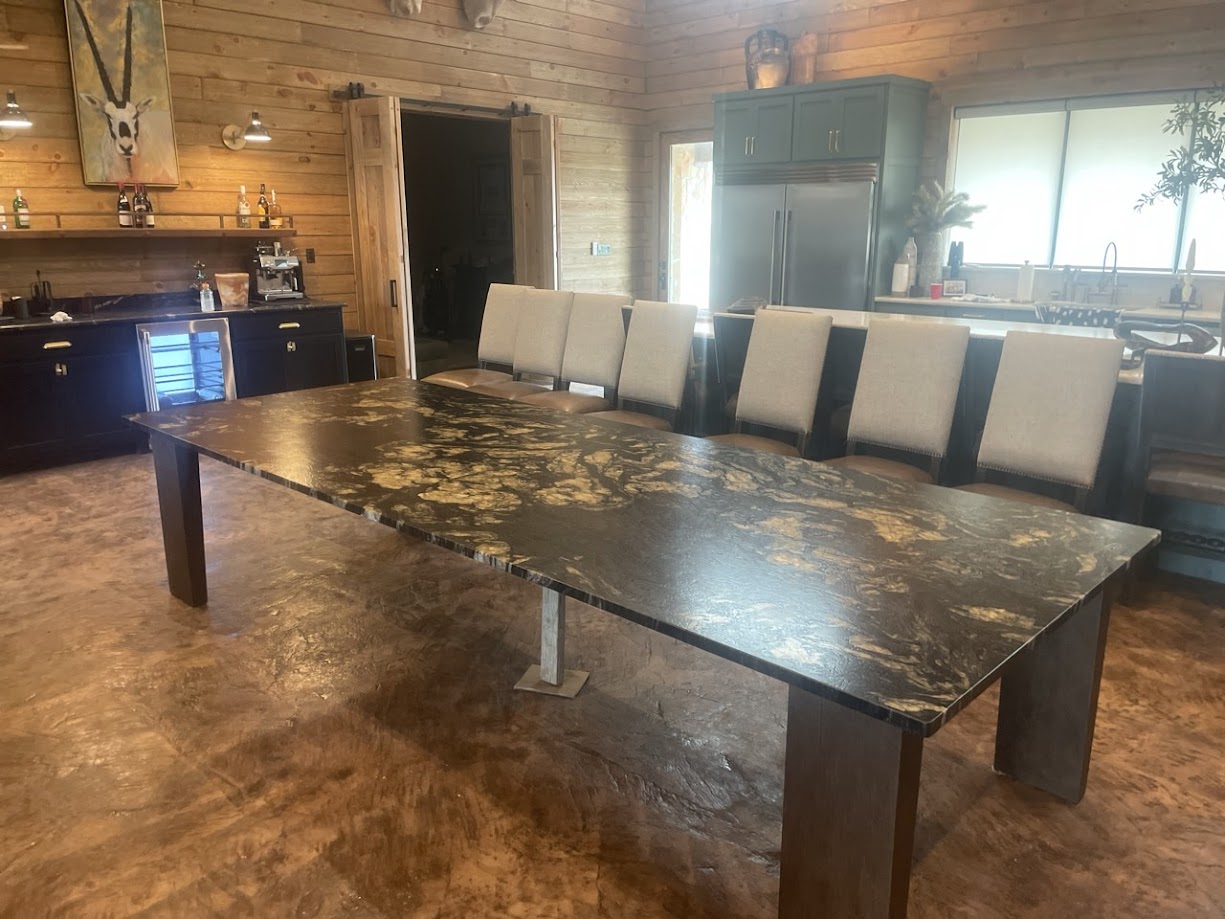Titanium Gold granite peninsula with stainless farmhouse sink — Central Texas