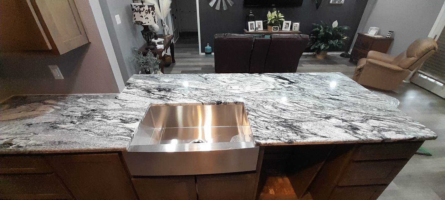 Viscount White granite bathroom vanity with dramatic dark veining and undermount sink — Central Texas