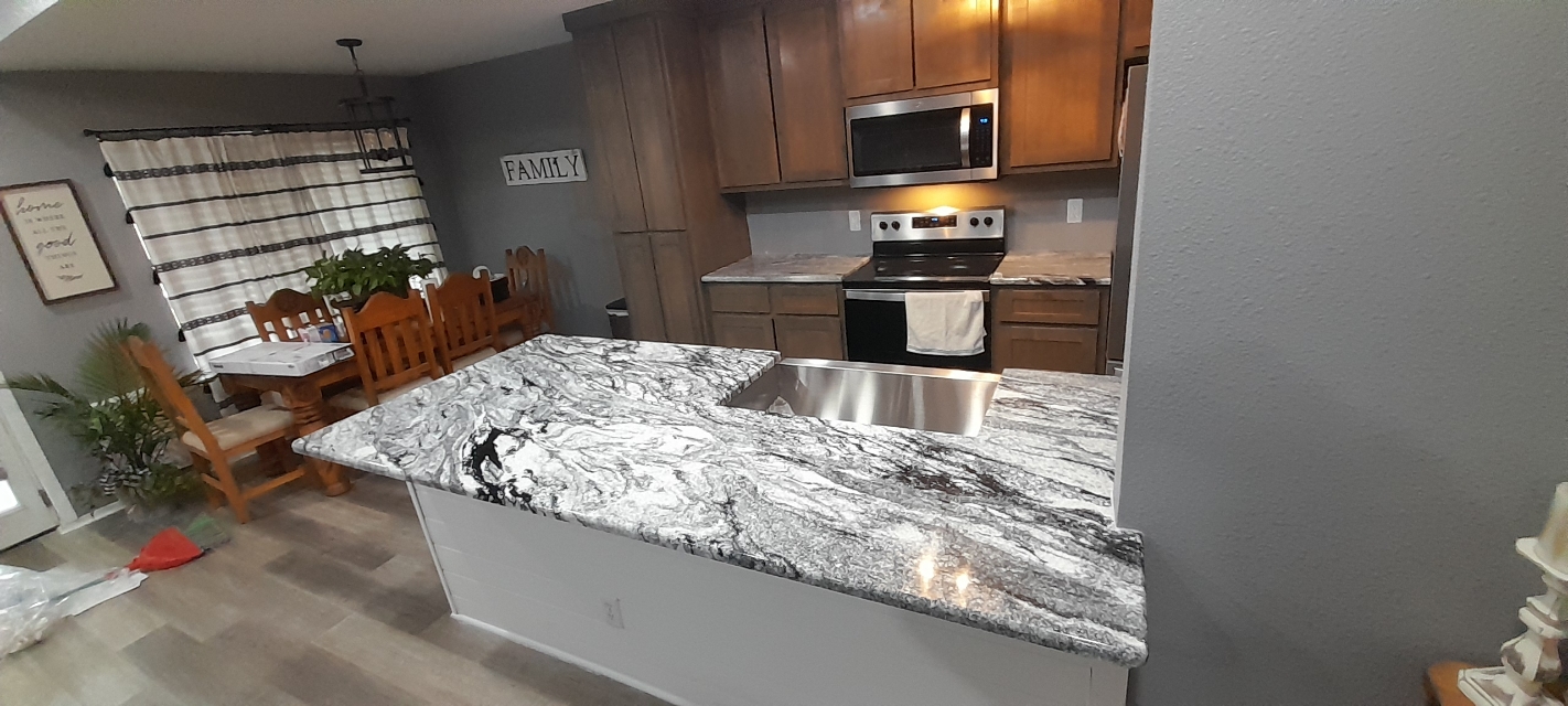 Viscount White granite kitchen countertops around electric range — Brownwood TX installation